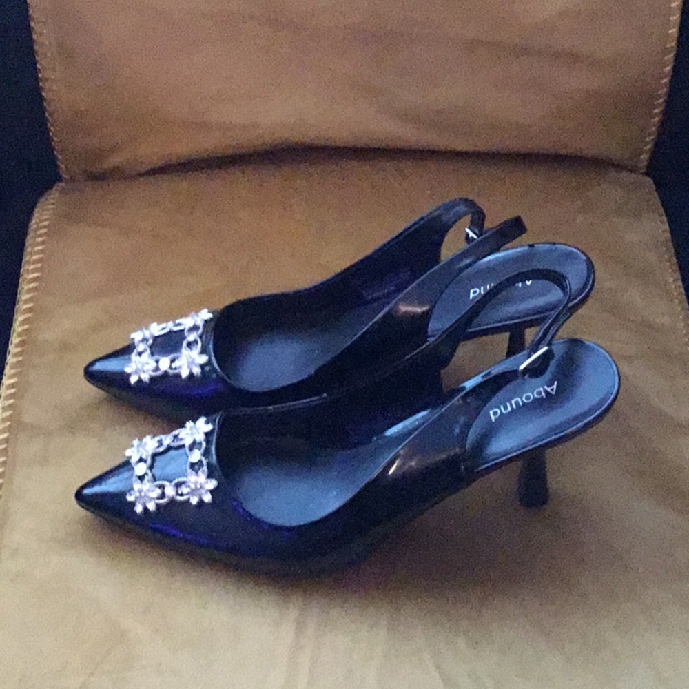Black patent leather sling back pumps